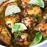 A baking dish with lemon cilantro chicken.