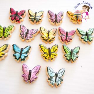 Hand painted butterfly shaped cookies.