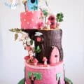 A cake made to look like an enchanted forest birdhouse.