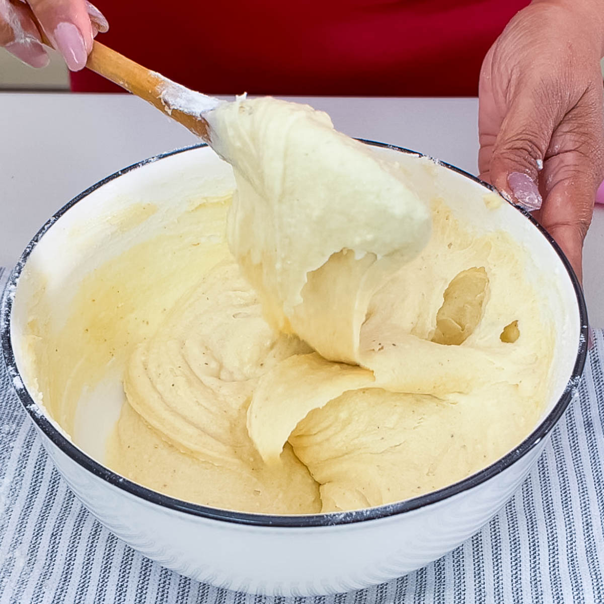 Fresh vanilla cake batter in a bowl.