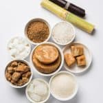 A variety of sugar types in small bowls.