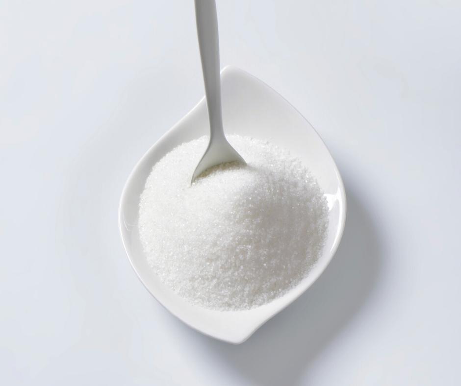 A bowl of white sugar.