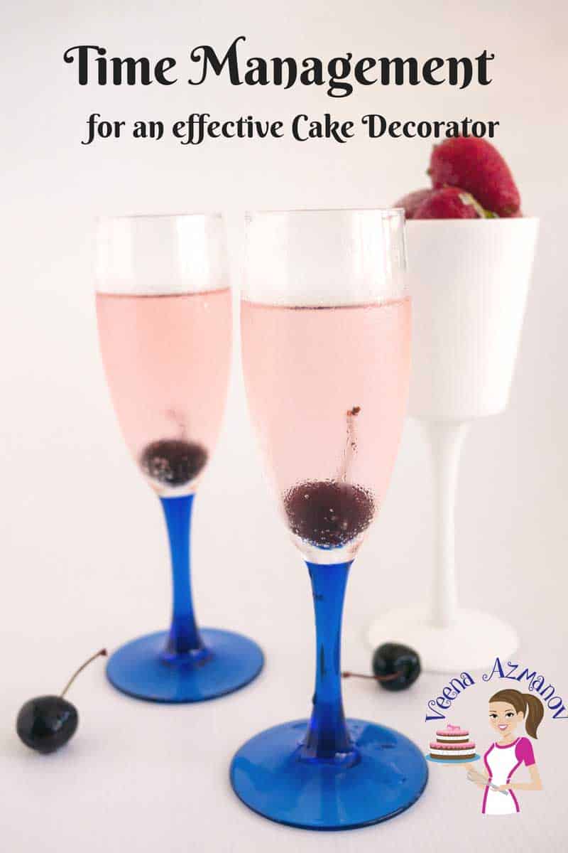Two wine glasses filled with pink champagne.