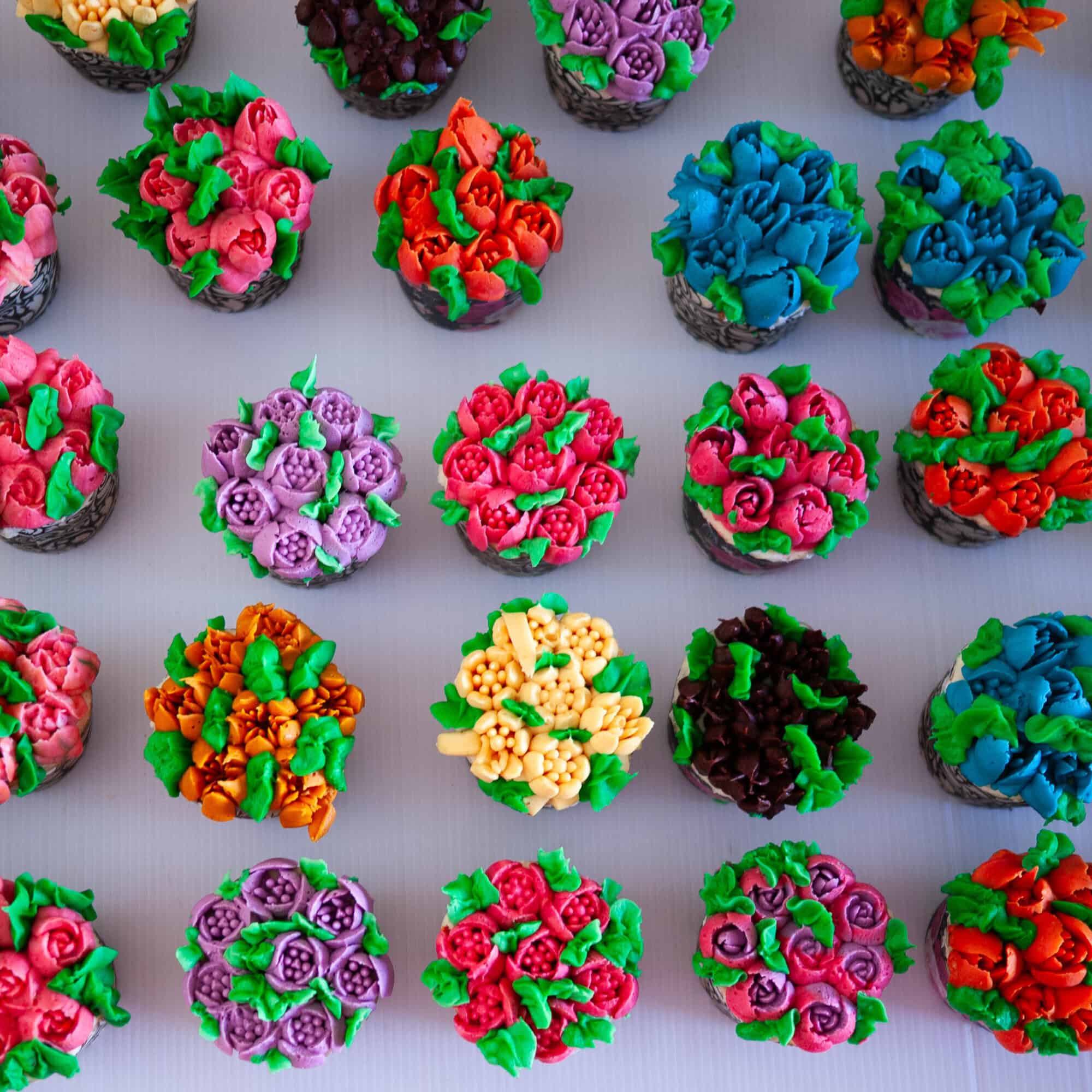 Frosted cupcakes on the table.