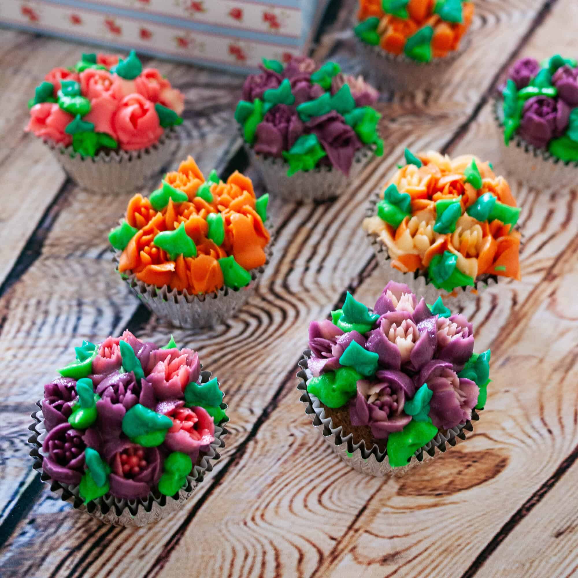 Frosted cupcakes on the table.
