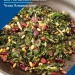 A skillet with kale and pine nuts