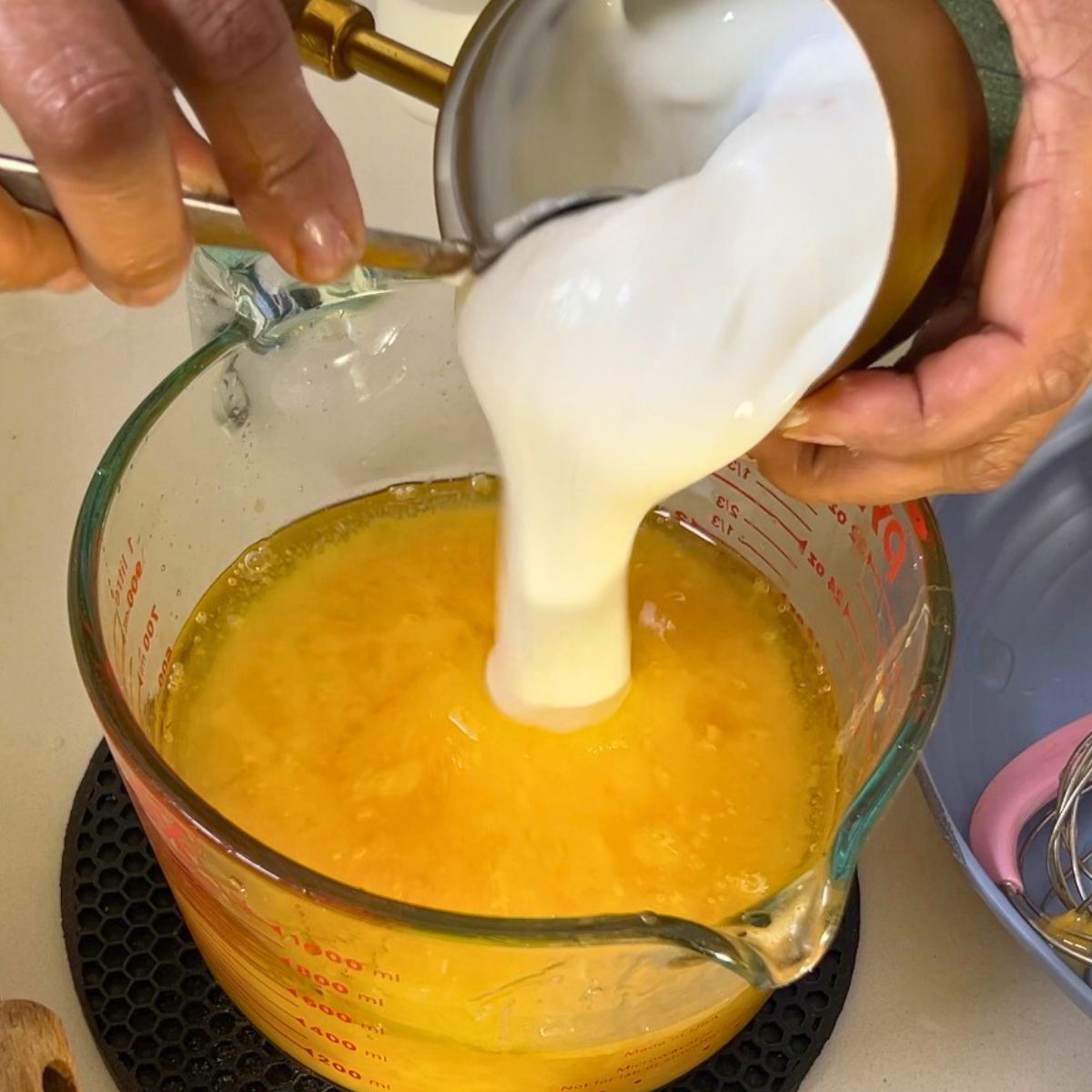 Wet ingredients for chocolate cake batter with Greek yogurt.