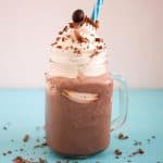A glass with handle and Frappuccino