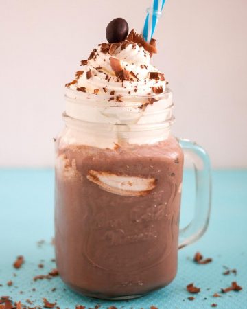 A glass with handle and Frappuccino