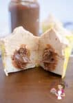 Dulce de leche cupcake sliced in half.