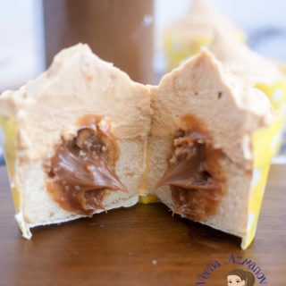 Dulce de leche cupcake sliced in half.