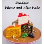 A cake decorated to look like three pieces of cheese.