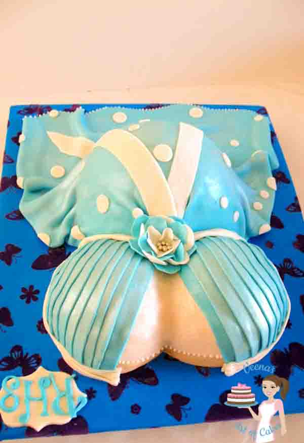 Pregnant Belly Cake can be a fun cake to make and who doesn't' like the idea of a pretty dress, the dresses for pregnant women are getting more trendy and exotic now a days so you have many more options than just draping fondant like a boring dress. The video and blog post is very detailed with tips for any one attempting this cake by Veenas Art of cakes