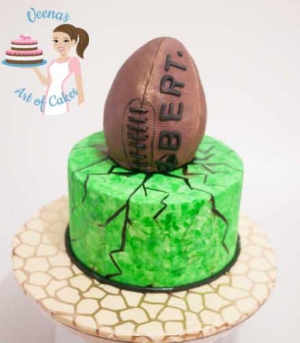 A cake decorated to look like a football.