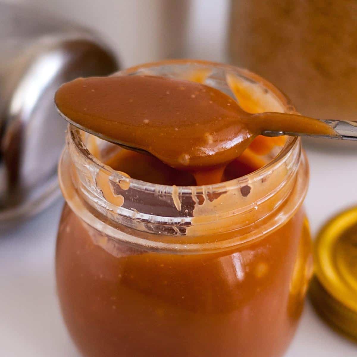 A mason jar with butterscotch sauce.