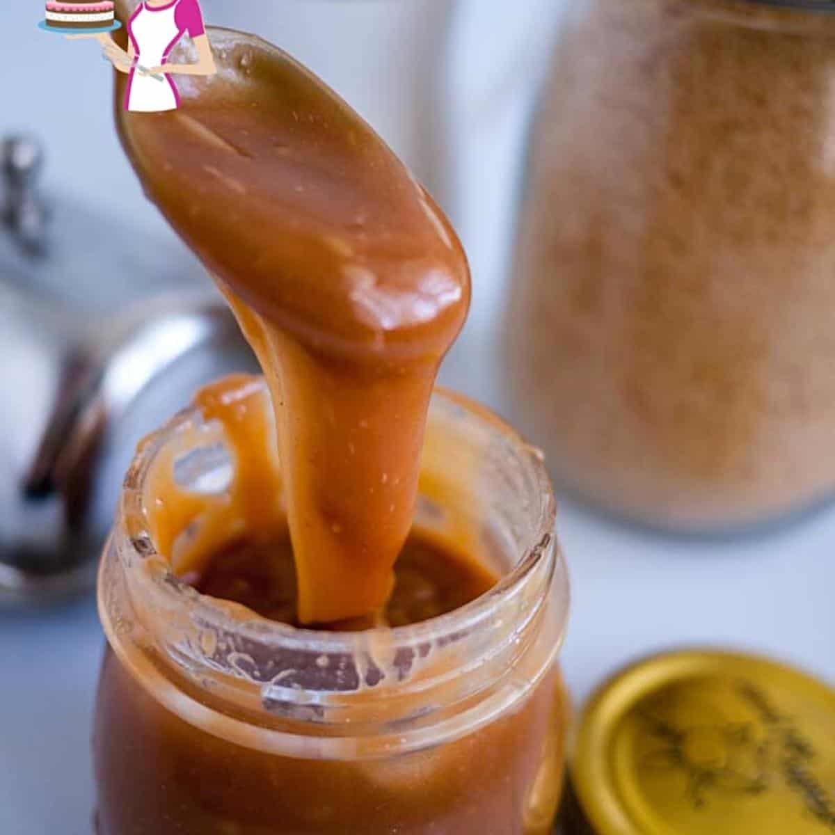Pouring butterscotch from a spoon.