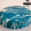 A blue and white mirror glaze cake.