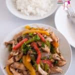 Chicken and peppers stir fry in a plate.