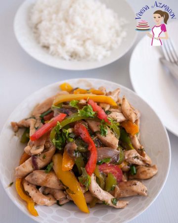 Chicken and peppers stir fry in a plate.