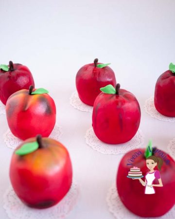 Mini cakes shaped like apples.