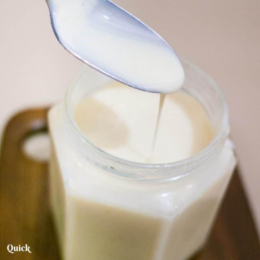 Condensed milk in a mason jar.
