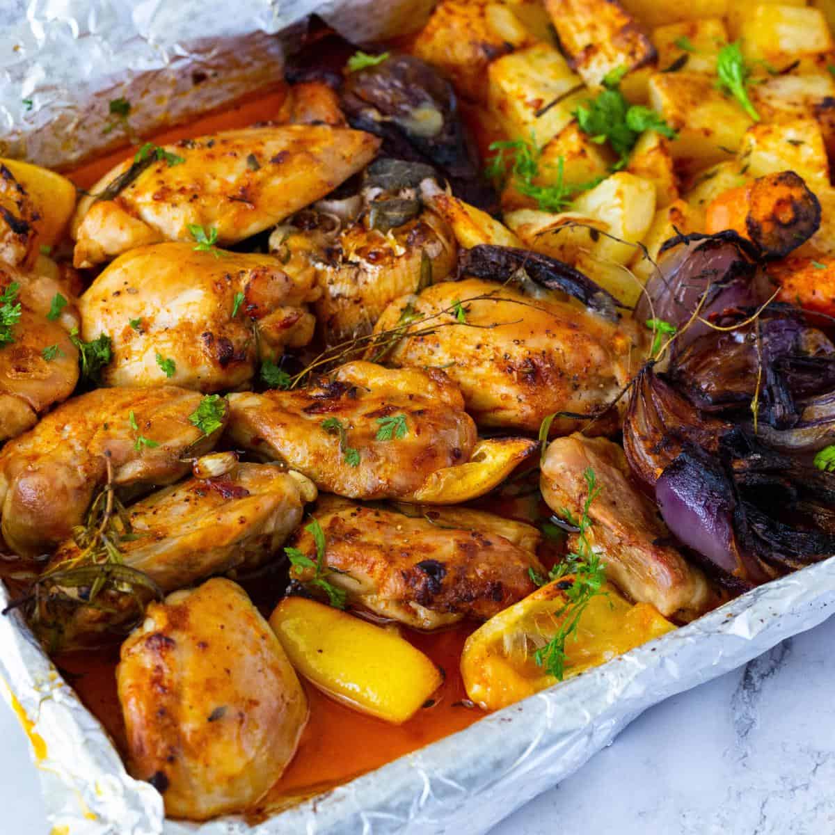 A sheet pan with paprika chicken.