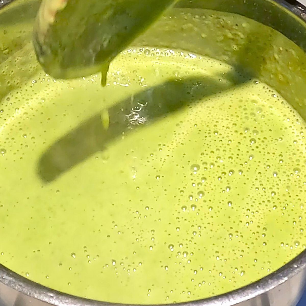 A pot of fresh green pea soup.