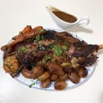 Serving platter with lamb shoulder.