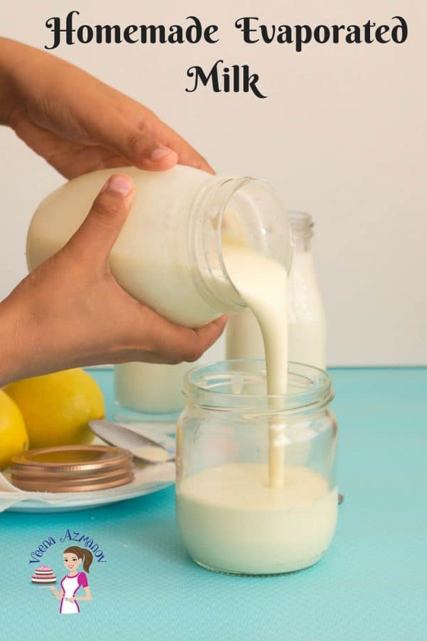 A person pouring evaporated milk into a jar.