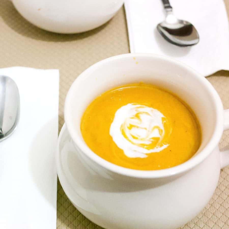 A bowl of pumpkin and sweet potato soup.