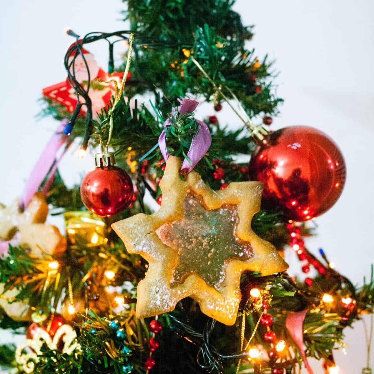 Snowflake ornament cookies on the Christmas tree.