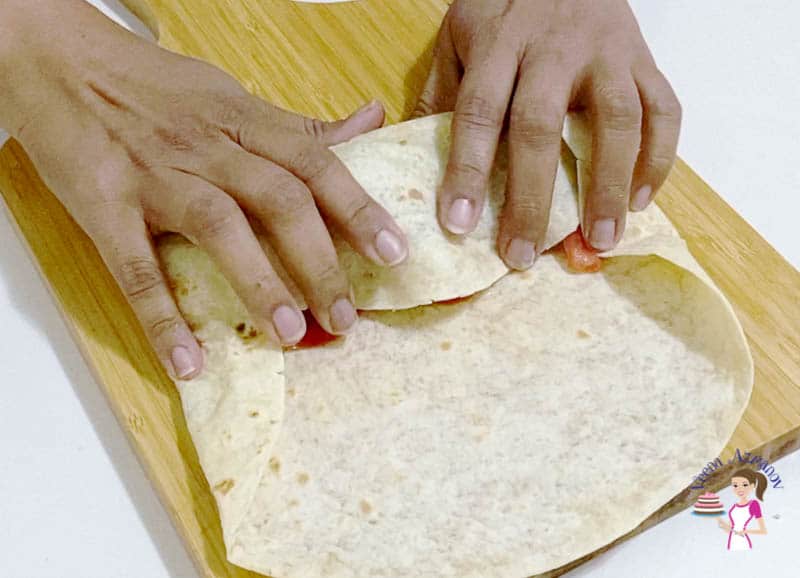 Wrapping the chicken tortilla