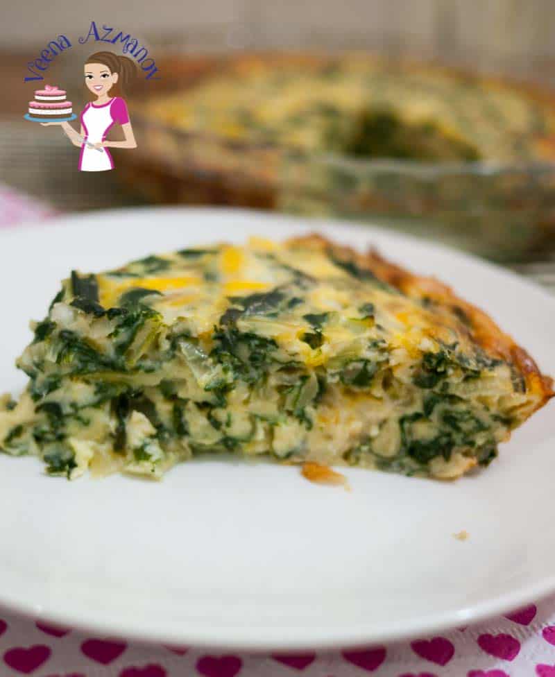 A slice of Swiss chard quiche on a plate.