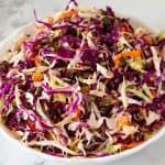 A bowl with shredded cabbage salad.