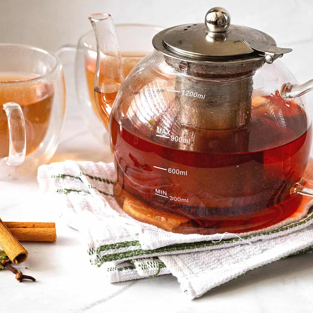 A glass kettle with spiced ginger tea.