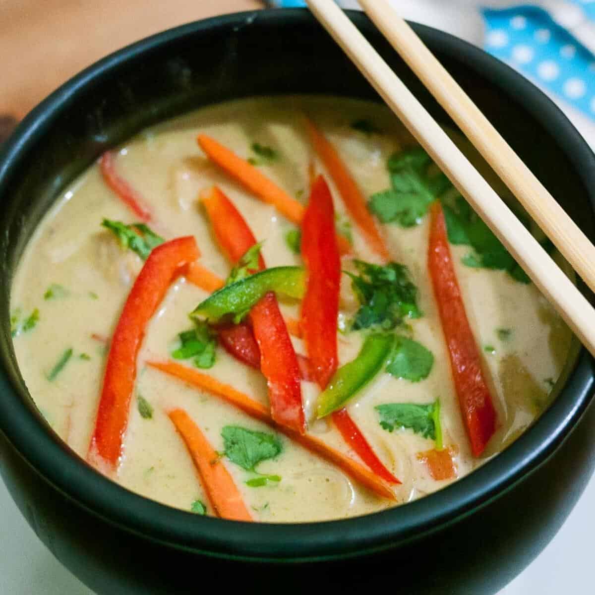 A bowl of Thai noodle soup with prawns.