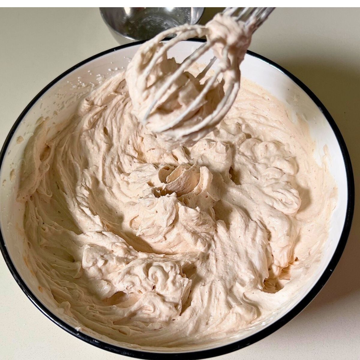 Whipping chestnut mousse in a bowl.