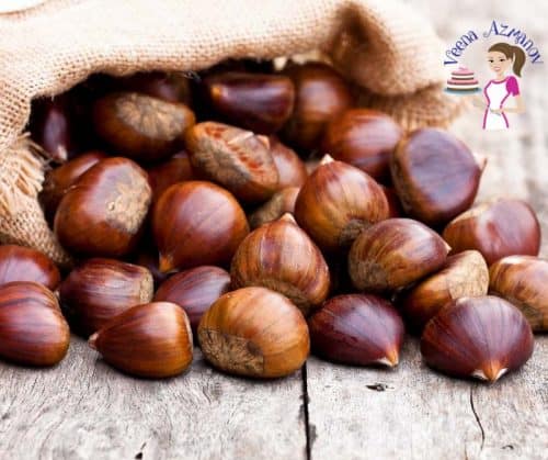 A stack of chestnuts on a table.