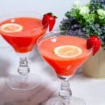 Two cocktail glasses with drinks.
