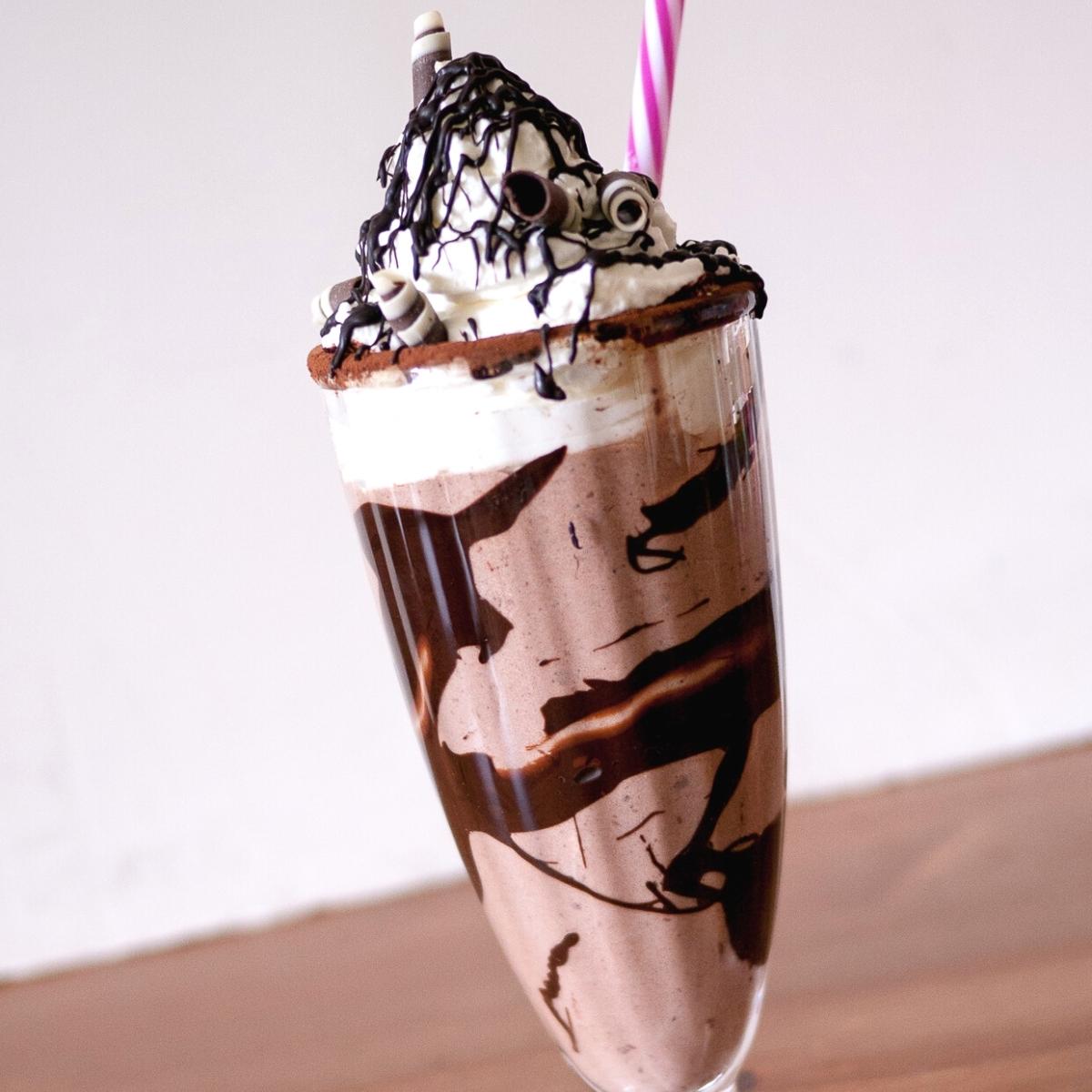A milkshake with straw