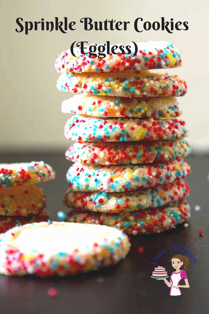A stack of sprinkle cookies on a table.