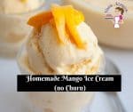 A scoop of mango flavored no-churn ice cream in a bowl topped with fresh mangoes