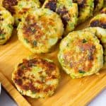 Patties on a wooden platter.