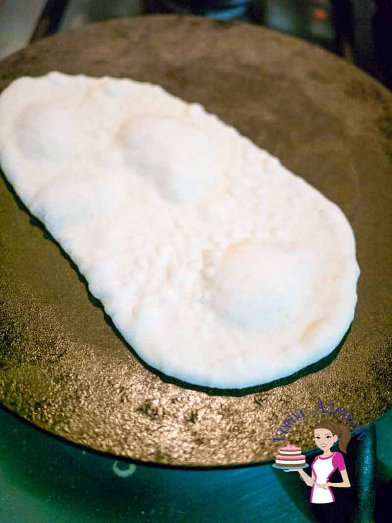The homemade naan is an absolute treat, which when made properly just melts in the mouth. This simple, easy and effortless recipe will make the most deliciously soft and supple bread that can be used to scoop any Indian curry, wrapped around meats. This recipe works perfectly when made on the stovetop, baked in the oven or even grilled on a hot summers day. This Homemade Naan is an absolute treat. Simple, easy and delicious laden bread to eat with any Indian curry. Add some butter for butter naan, a few crushed garlic cloves for a garlic naan twist or simply sprinkle with pretty nigella seeds.
