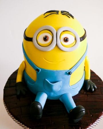 A cake decorated to look like a minion.