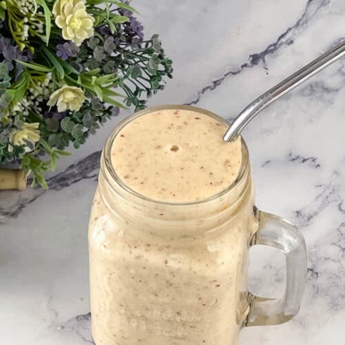 Smoothie in a jar with straw.