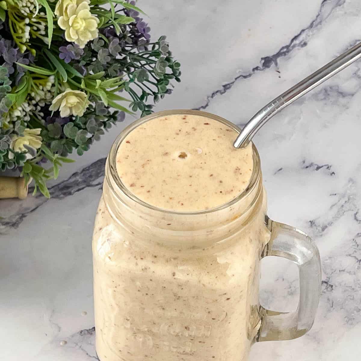 Smoothie in a jar with straw.