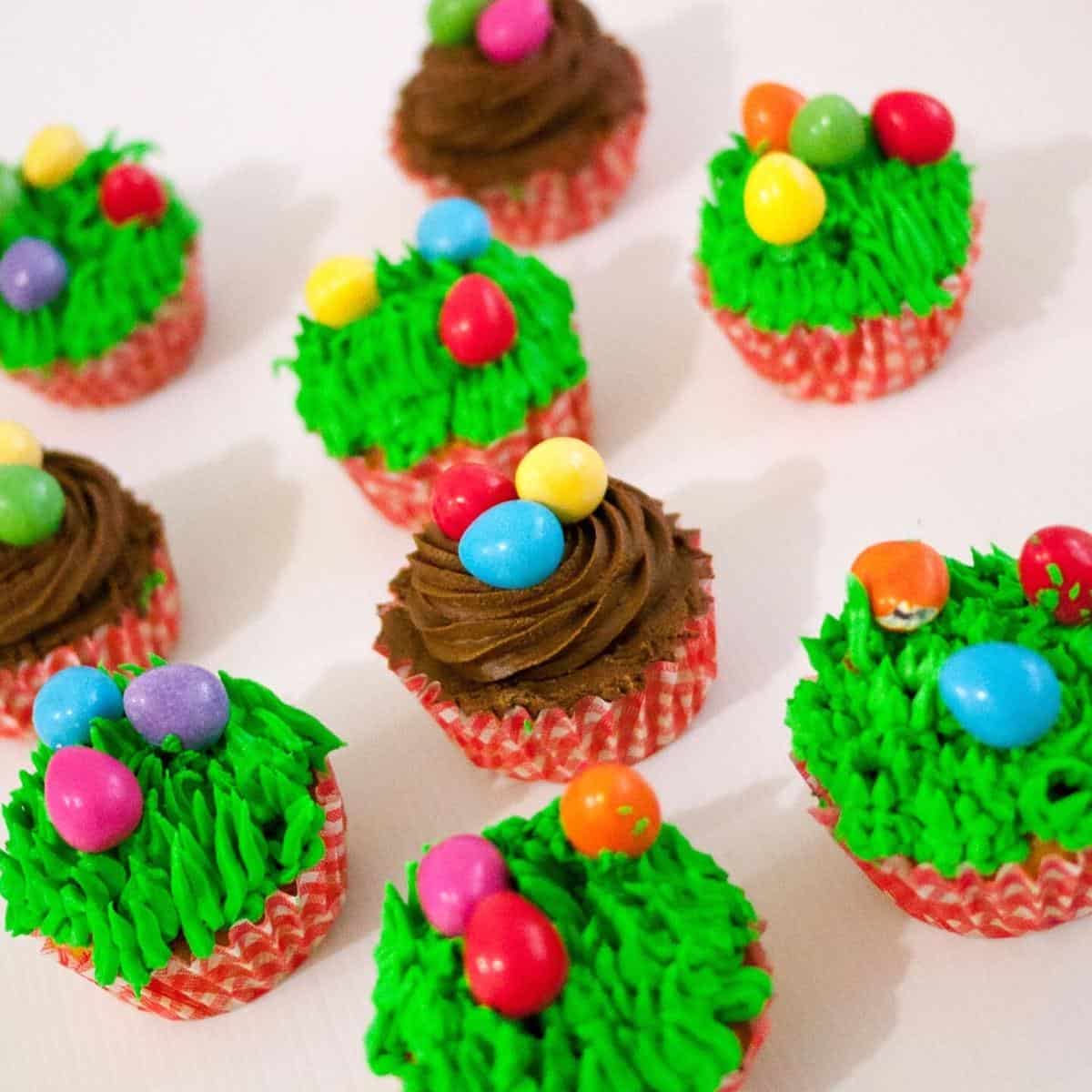 Frosted carrot cupcakes for easter with candy eggs.