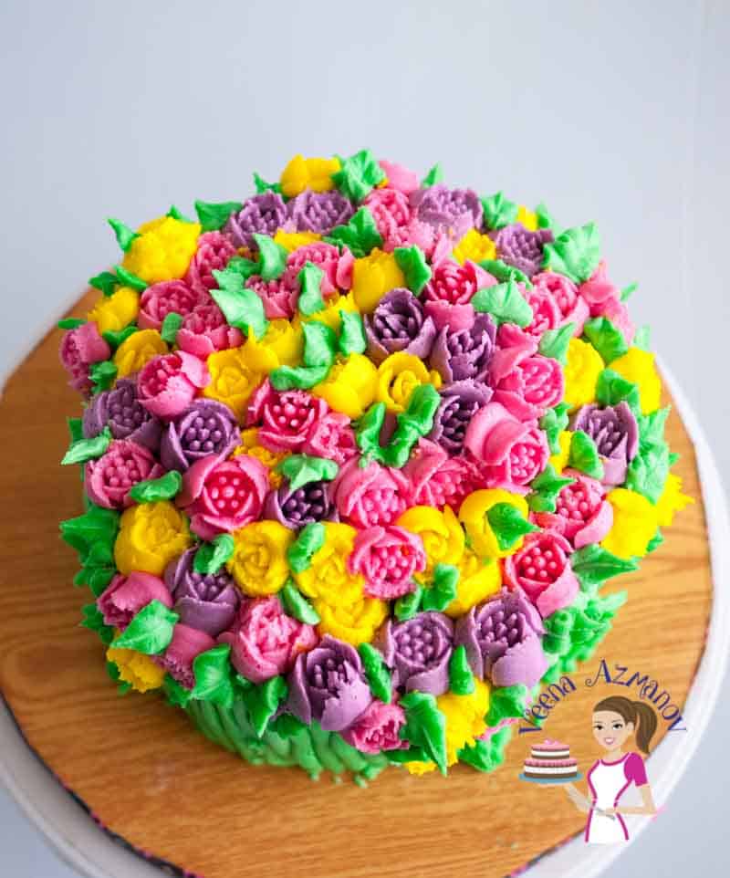 A cake decorated with buttercream flowers.