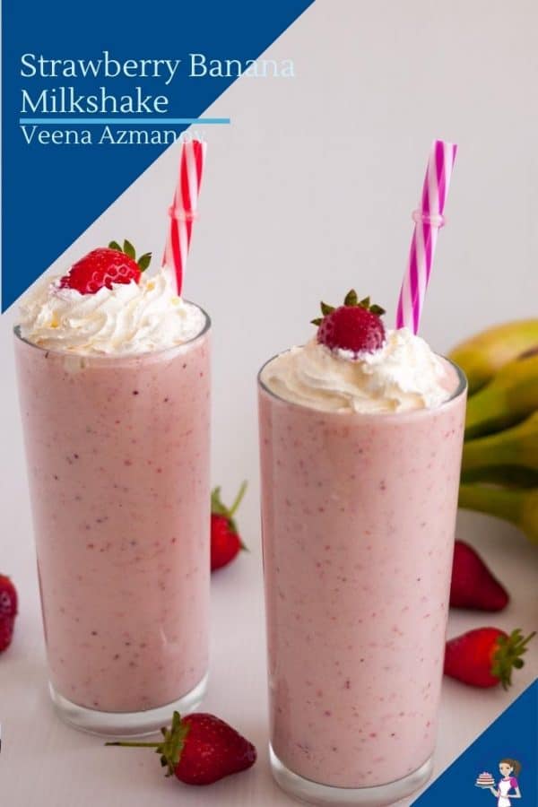 Two glasses with milkshake topped with strawberry